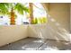 Private covered patio with view of landscaping and other residential buildings in community at 2611 S Durango Dr # 102, Las Vegas, NV 89117