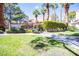 Community pool area with green lawns, mature trees, and well-maintained landscaping at 2611 S Durango Dr # 102, Las Vegas, NV 89117