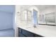 Modern bathroom featuring dual mirrors, a sleek vanity, and neutral walls at 3542 Arcadian King Ave, Las Vegas, NV 89106