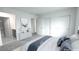 This bedroom features a white dresser, a closet with sliding doors, and modern staging at 3542 Arcadian King Ave, Las Vegas, NV 89106