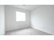 Bedroom with neutral carpet, white walls, and a window at 3542 Arcadian King Ave, Las Vegas, NV 89106