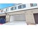 Exterior of building showing garage doors, driveways, blue bins, and house numbers 3542 and 3538 at 3542 Arcadian King Ave, Las Vegas, NV 89106