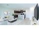 Bright, open-concept living area flows into kitchen with dark cabinets, stainless appliances, and breakfast bar at 3542 Arcadian King Ave, Las Vegas, NV 89106
