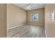 Spacious bedroom featuring neutral walls, a ceiling fan, and wood-look floors at 3544 Desert Cliff St # 102, Las Vegas, NV 89129