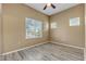 Bedroom featuring light-colored walls and laminate flooring along with natural light at 3544 Desert Cliff St # 102, Las Vegas, NV 89129