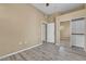 This bedroom has a large mirrored closet and laminate flooring at 3544 Desert Cliff St # 102, Las Vegas, NV 89129