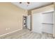 Bedroom with closet, in unit washer/dryer, and wood-look floors at 3544 Desert Cliff St # 102, Las Vegas, NV 89129