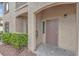 Covered condo entrance with security door and neutral-toned stucco at 3544 Desert Cliff St # 102, Las Vegas, NV 89129