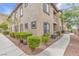 Condo exterior with manicured landscaping, walkway and neutral-toned stucco at 3544 Desert Cliff St # 102, Las Vegas, NV 89129