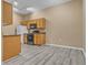Efficient kitchen featuring all appliances and wood-style flooring at 3544 Desert Cliff St # 102, Las Vegas, NV 89129