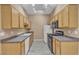 Efficient kitchen featuring all appliances, ample cabinets and wood-style flooring at 3544 Desert Cliff St # 102, Las Vegas, NV 89129