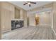 Living room featuring fireplace, wood-style flooring and neutral paint at 3544 Desert Cliff St # 102, Las Vegas, NV 89129