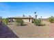 A low maintenance backyard is surrounded by desert landscaping at 3568 Antigua Ave, Las Vegas, NV 89121