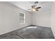 A bright bedroom has neutral walls, carpet, and a ceiling fan at 3568 Antigua Ave, Las Vegas, NV 89121