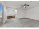 Neutral bedroom with wood look flooring, ceiling fan, and access to ensuite bath at 3568 Antigua Ave, Las Vegas, NV 89121