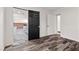 Hallway view leading to the living room with neutral paint and wood-look floors at 3568 Antigua Ave, Las Vegas, NV 89121