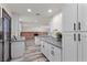 Updated kitchen features a large island and bright white cabinets at 3568 Antigua Ave, Las Vegas, NV 89121