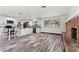 Spacious kitchen with modern appliances, large island, and brick fireplace at 3568 Antigua Ave, Las Vegas, NV 89121