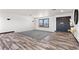 Spacious living room with modern floors and a stylish front door at 3568 Antigua Ave, Las Vegas, NV 89121