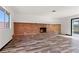 Spacious living room with a brick fireplace and modern flooring at 3568 Antigua Ave, Las Vegas, NV 89121
