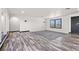 Welcoming living room with updated floors and modern lighting at 3568 Antigua Ave, Las Vegas, NV 89121