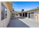 A concrete patio extends across the rear of the home with multiple access points at 3568 Antigua Ave, Las Vegas, NV 89121