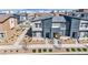 Aerial view of new townhomes showcasing modern exteriors, landscaping, and a vibrant community setting at 3725 Celesta Vista Ave, Henderson, NV 89044