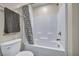 Bright bathroom with a white tile shower-tub combination and modern fixtures at 3725 Celesta Vista Ave, Henderson, NV 89044