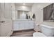 Bathroom boasts a double sink vanity, white cabinets, and modern fixtures at 3725 Celesta Vista Ave, Henderson, NV 89044