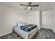 Comfortable bedroom features a ceiling fan, closet, and doorway to the bathroom at 3725 Celesta Vista Ave, Henderson, NV 89044