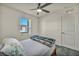 Bright bedroom features a ceiling fan and a window with a view of the outdoors at 3725 Celesta Vista Ave, Henderson, NV 89044