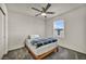 Bedroom features single bed, fan and window with modern blinds at 3725 Celesta Vista Ave, Henderson, NV 89044