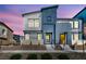 Inviting two-story home showcasing a modern design, beautiful landscaping, and a vibrant yellow front door at 3725 Celesta Vista Ave, Henderson, NV 89044