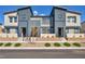 Modern townhouse complex featuring contemporary architecture and well-manicured landscaping at 3725 Celesta Vista Ave, Henderson, NV 89044