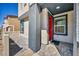 Inviting front porch area featuring a red front door and stylish tiled entryway at 3725 Celesta Vista Ave, Henderson, NV 89044