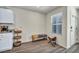 Kitchen with laminate floors, white cabinets, and a view of the front door at 3725 Celesta Vista Ave, Henderson, NV 89044