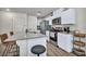 Kitchen features stainless steel appliances, gray counters and bar stool seating at 3725 Celesta Vista Ave, Henderson, NV 89044