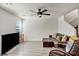 Inviting living room with hardwood floors, a comfortable leather sofa, and lots of open space at 3725 Celesta Vista Ave, Henderson, NV 89044