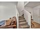 Carpeted staircase with white walls and a comfortable couch nearby at 3725 Celesta Vista Ave, Henderson, NV 89044