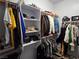 Organized walk-in closet with shelving and hanging space for clothes and accessories at 3836 Quail Creek Dr, North Las Vegas, NV 89032