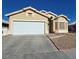 Inviting single-story home featuring a wide two-car garage and desert landscaping at 3836 Quail Creek Dr, North Las Vegas, NV 89032