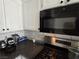 Close-up of a kitchen featuring stainless steel appliances, white cabinets, and dark countertops at 3836 Quail Creek Dr, North Las Vegas, NV 89032