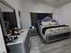 Stylish main bedroom featuring decorative headboard, modern furniture, and a cozy atmosphere at 3836 Quail Creek Dr, North Las Vegas, NV 89032