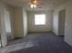 A carpeted bedroom with ceiling fan and neutral walls that offers a comfortable space at 3916 Via Lucia Dr, Las Vegas, NV 89115