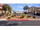 Community featuring well-maintained landscaping, parking spaces, and views of the city skyline at 4019 Delos Dr, Las Vegas, NV 89103