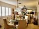 Elegant dining room featuring a glass table, chandelier, and mirrored accent wall at 4019 Delos Dr, Las Vegas, NV 89103