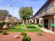 Inviting two-story condo featuring private balconies and well-manicured lawn with mature trees at 4019 Delos Dr, Las Vegas, NV 89103