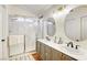 Bathroom featuring dual vanities, modern fixtures, and a glass-enclosed shower for a spa-like experience at 422 Tanita Ct, Las Vegas, NV 89123