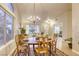 Bright dining room featuring a chandelier and large windows for ample natural light at 422 Tanita Ct, Las Vegas, NV 89123