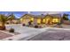 Charming single-story home featuring professional landscaping, warm lighting, and ample parking at 422 Tanita Ct, Las Vegas, NV 89123